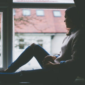 Girl sitting on the window